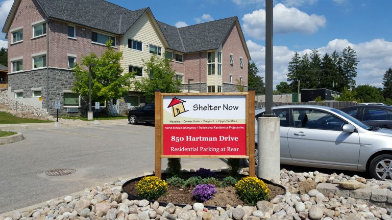 Shelter Now Front Sign